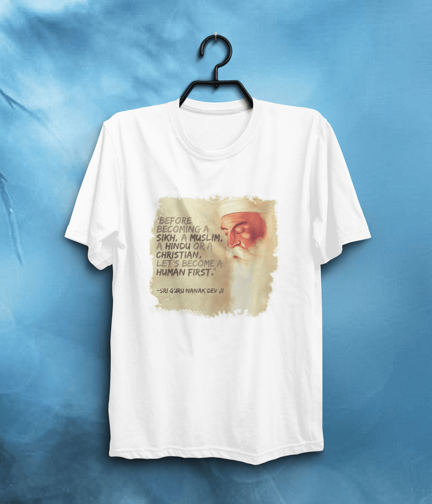 Become a Human First" Graphic Quote T-Shirt | Sri Guru Nanak Dev Ji In White